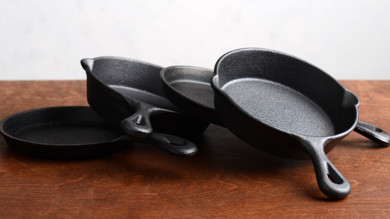 cast iron skillets stacked on counter
