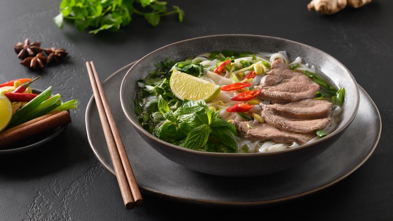 steaming bowl of traditional pho