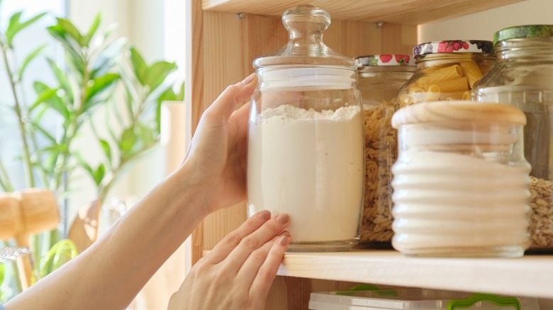jar with flour in kitchen pantry