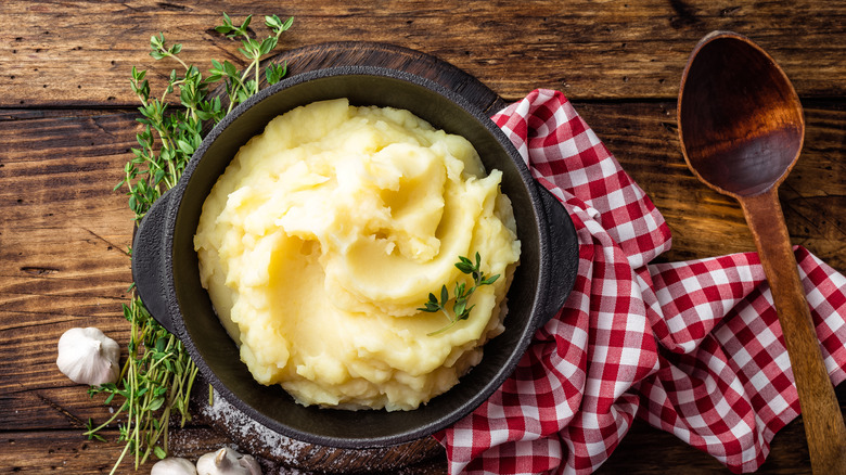mashed potatoes displayed on wooden surface
