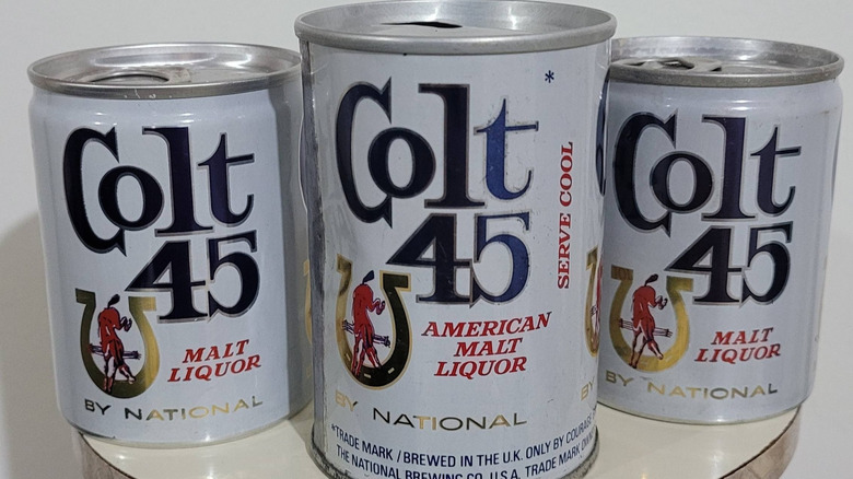 Three vintage cans of Colt 45 American Malt Liquor