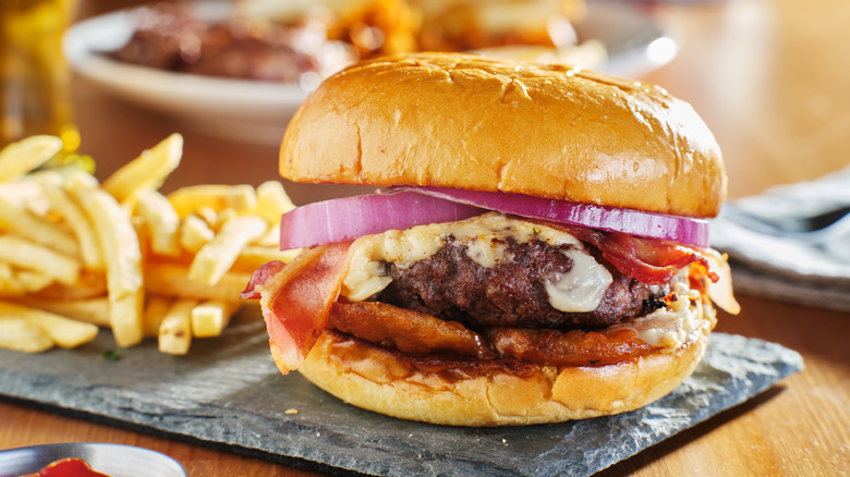 Burger with white cheese, onions, bacon