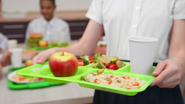 holding school lunch tray