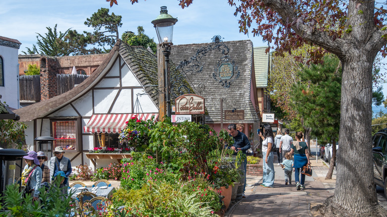 pedestrians in the street outside a local restaurant in Carmel, California
