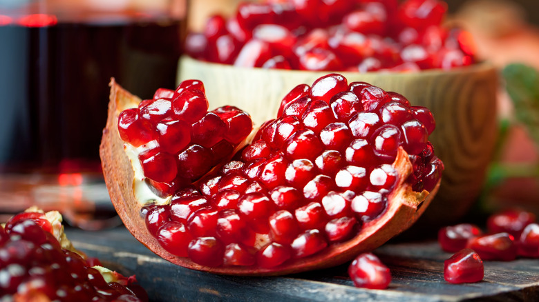 Split pomegranate with exposed seeds