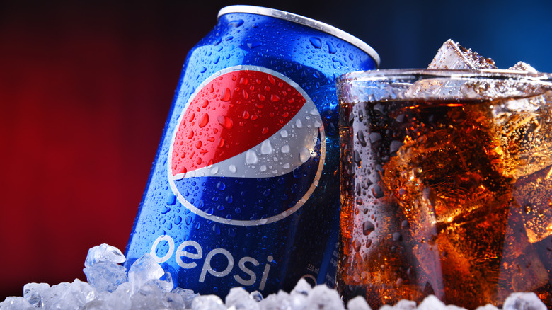 Pepsi can and glass in ice