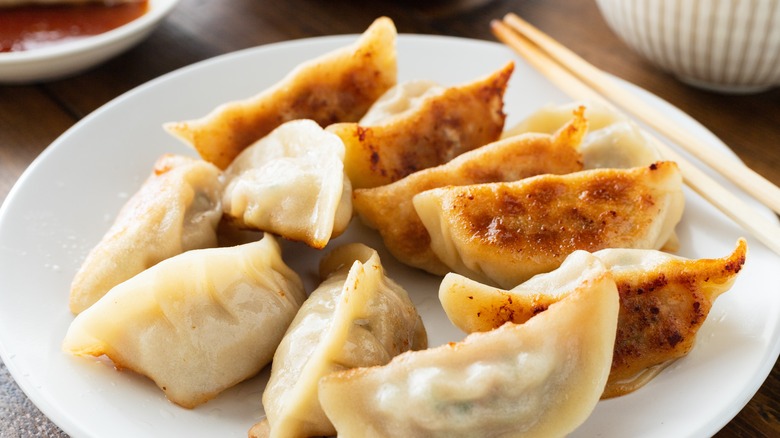 Potstickers on white plate 