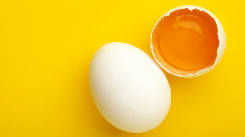Egg yolk on a yellow background