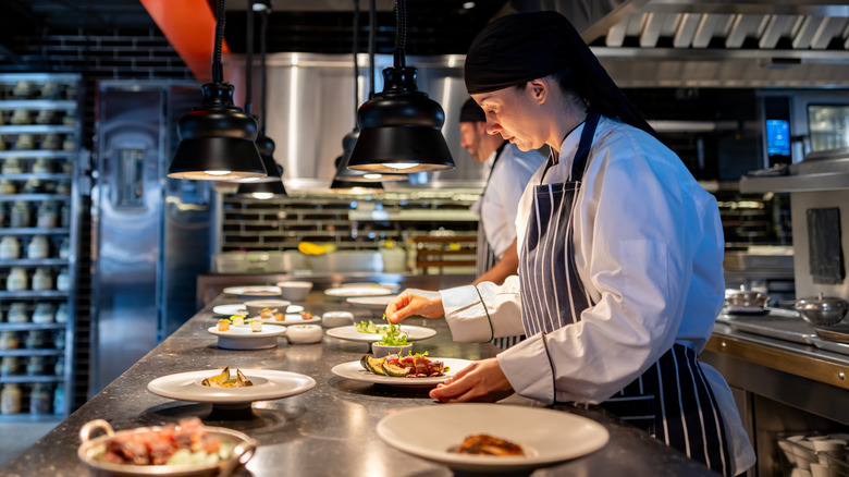 Professional chef finishing the plates