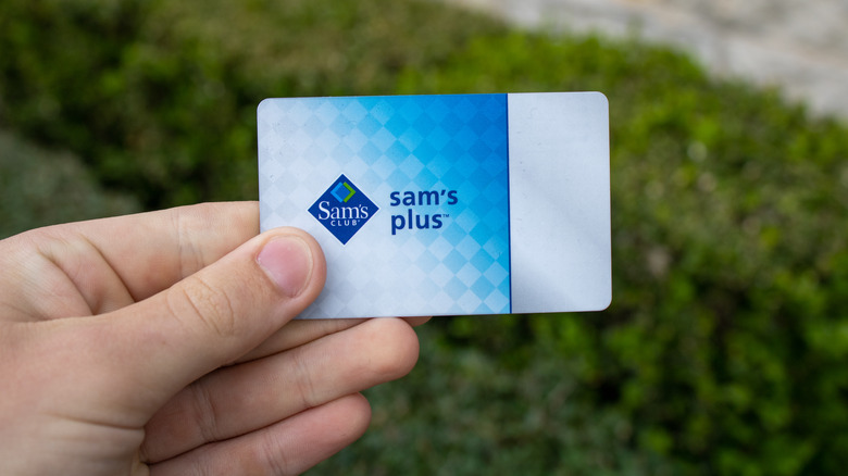 holding Sam's Club card