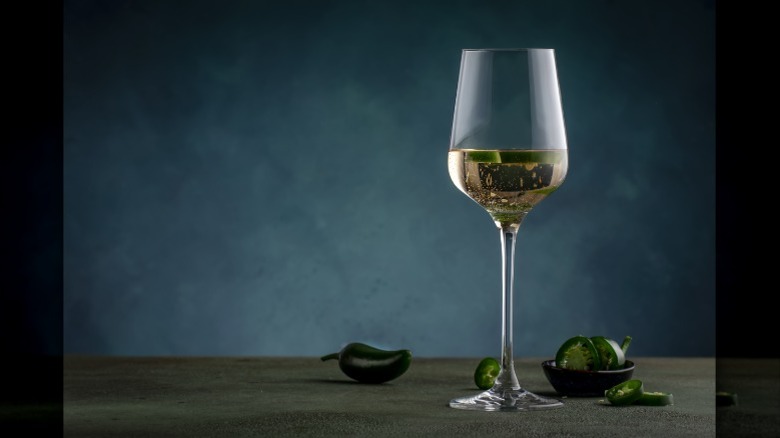 Jalapeño pieces floating inside wine