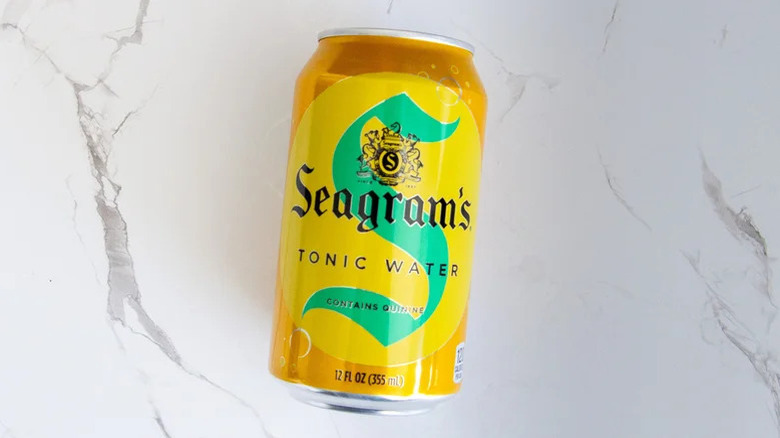 A can of Seagram's tonic water lies on a marble counter.