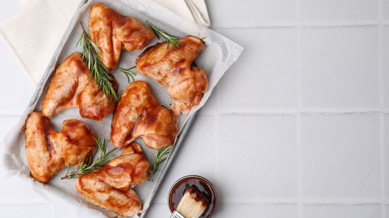 Marinated chicken wings on pan