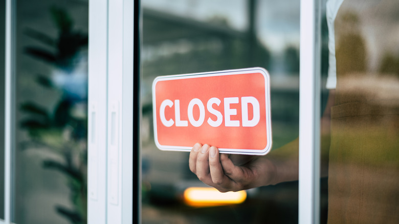 Closed sign on restaurant window