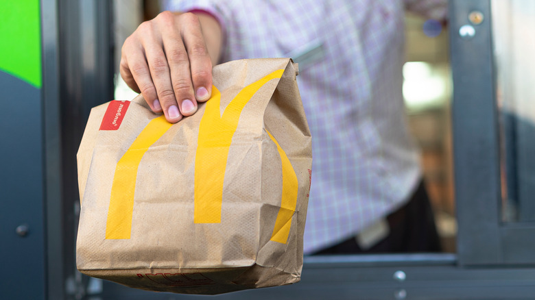 McDonald's employee hands over bag