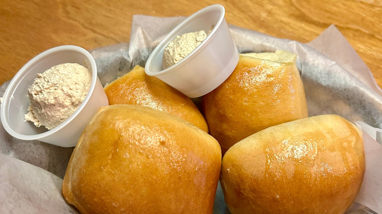 Close-up of Texas Roadhouse rolls and honey cinnamon butter