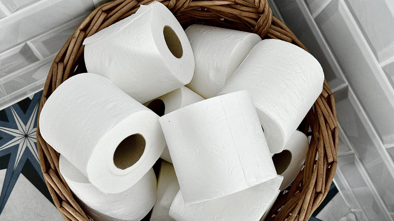Rolls of toilet paper in a basket