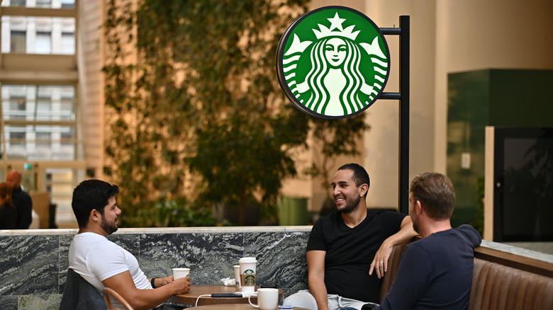 Patrons visit a Starbucks location 