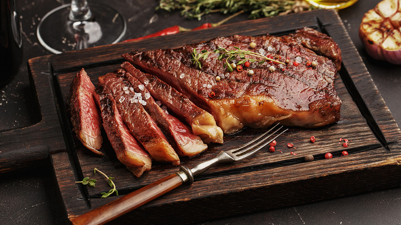 Cut steak on cutting board