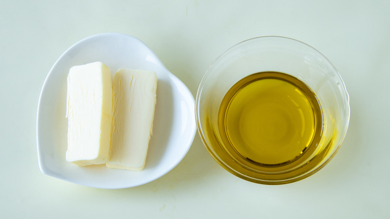 pats of butter and oil in a bowl