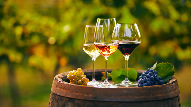 glasses of wine on barrel