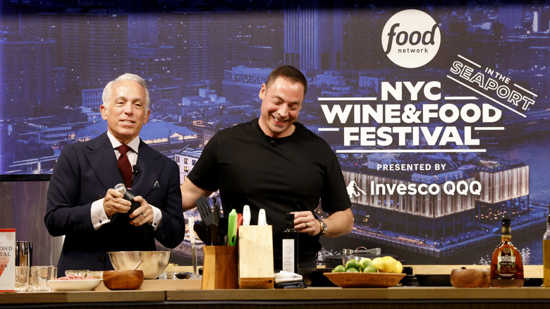 Geoffrey Zakarian and Jeff Mauro presenting a cooking demonstration at the 2025 New York City Wine & Food Fest