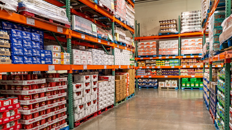 A Costco aisle, with merchandise piled to the ceiling on pallets
