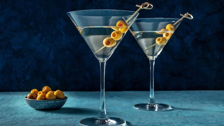 Two martini cocktails with olives