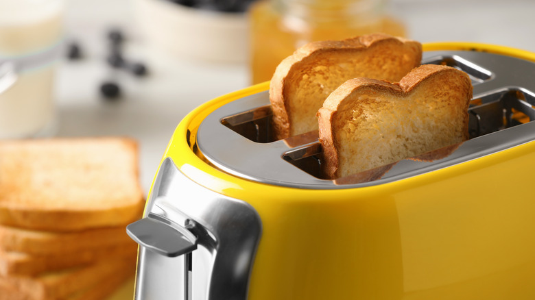 Toast popping out of a yellow toaster
