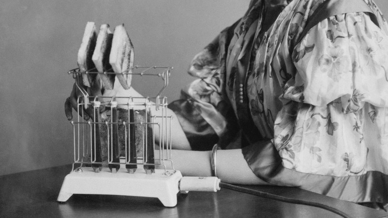 An antique photo of an early, exposed element toaster