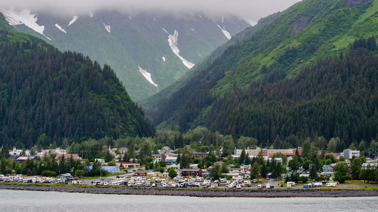 coastal town in Alaska with mountains in background