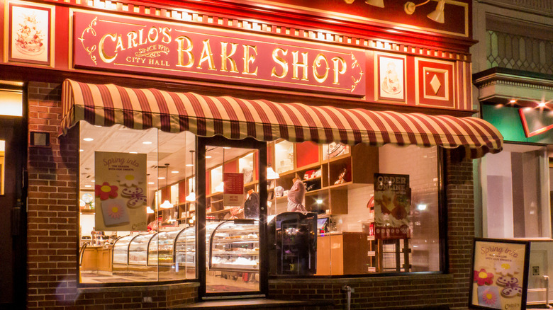 Outside exterior of Carlo's Bake Shop at night time