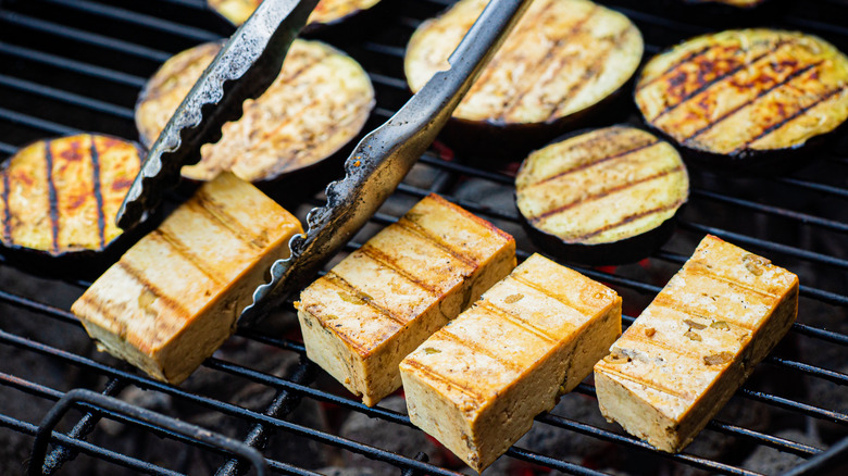 tofu and eggplant rounds on a grill