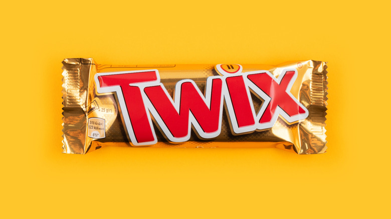 Twix bar on a yellow background