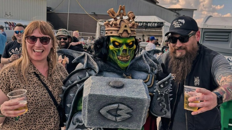 fans at dark lord day posing with the 3 Floyds mascot