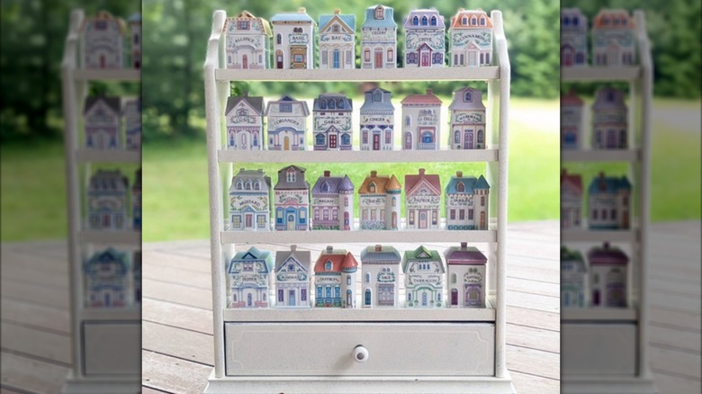 Vintage Lenox Spice Village jars on a rack