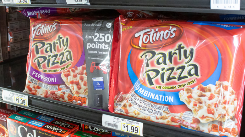 Frozen Totino's pizzas in freezer aisle