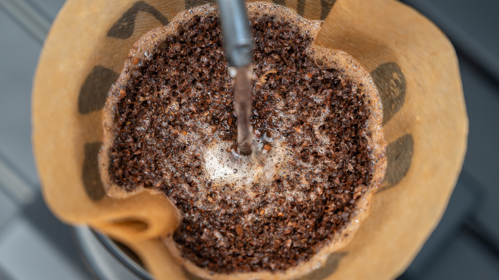 Why Washing Coffee Grounds Down The Drain Is Such A Bad Idea