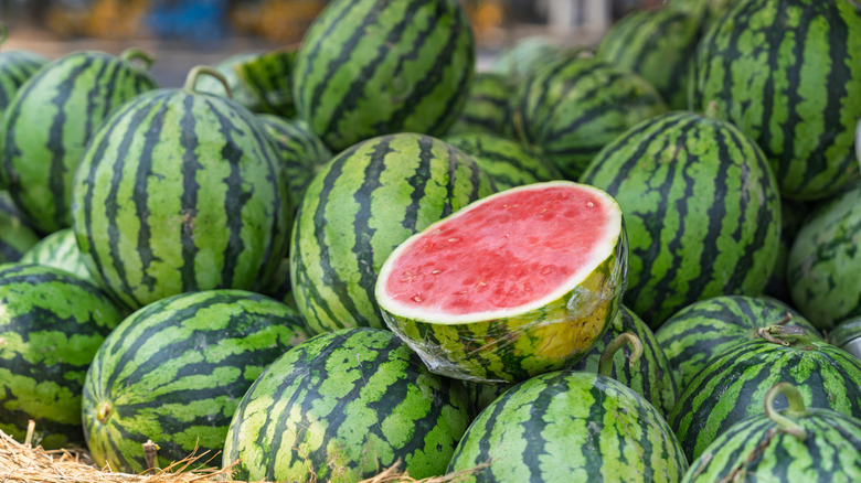 Whole watermelons, and one halved