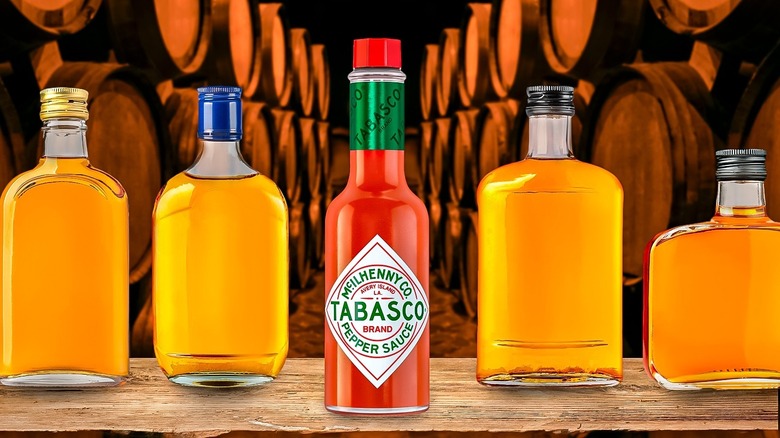 A bottle of Tabasco and several whiskey bottles