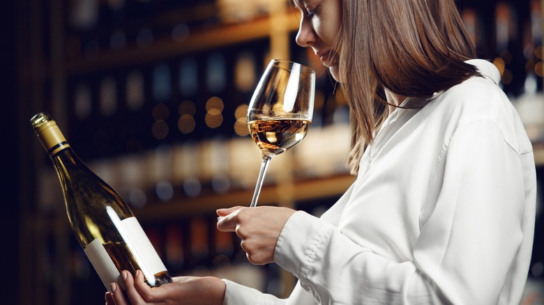 person reading wine label