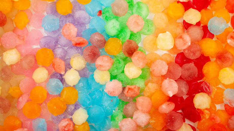 A close up of rainbow colored ice cubes