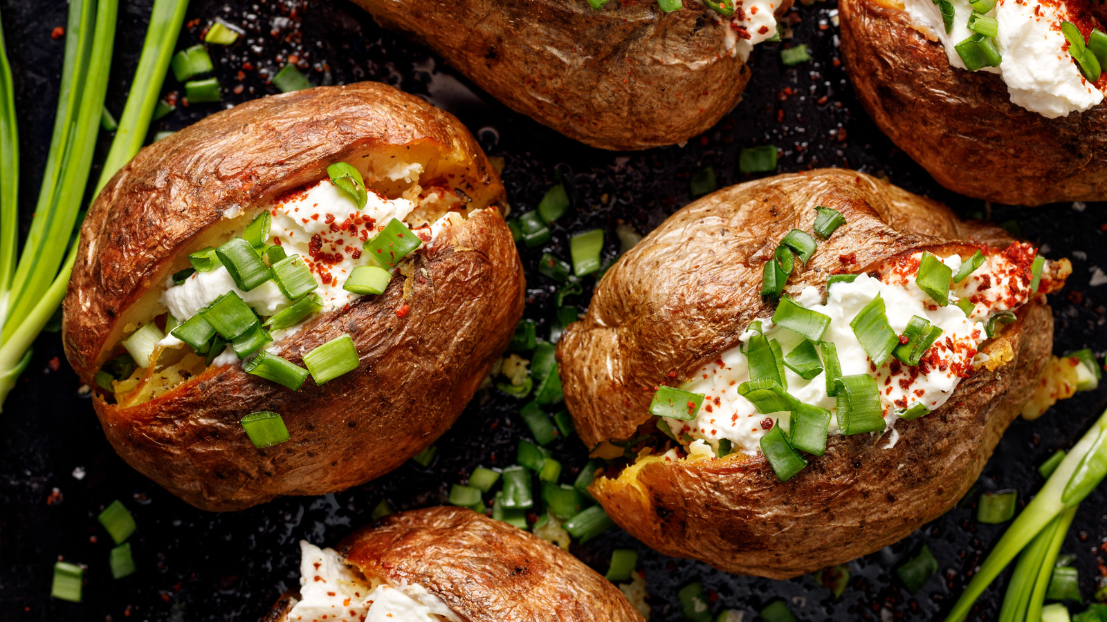 Why You Don't Have To Wait That Long For Baked Potatoes At A Restaurant