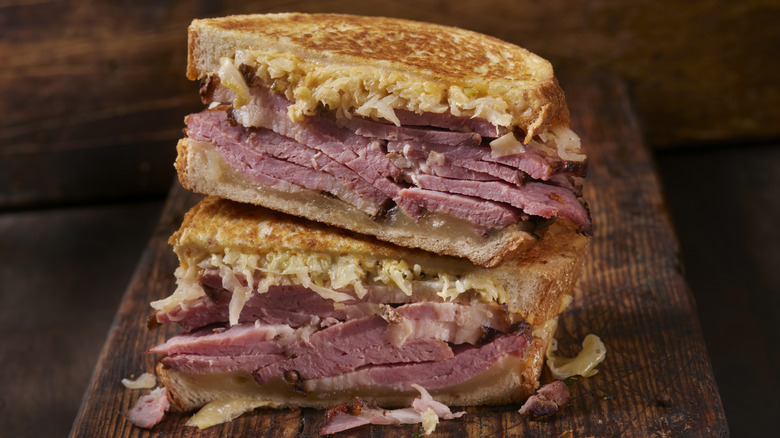 a sliced and stacked Reuben sandwich with thick-cut homemade corned beef