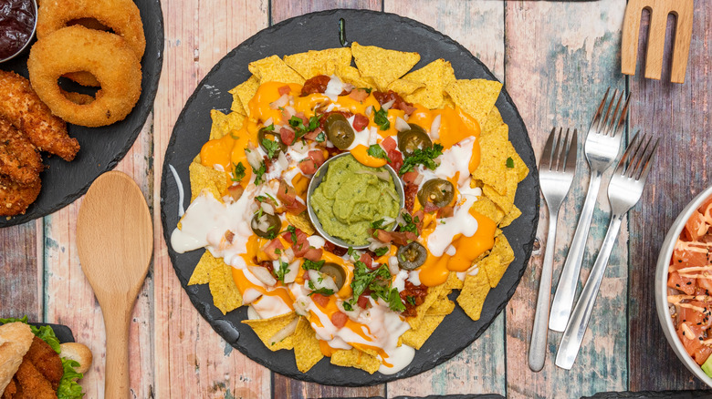 nachos with guacamole in center