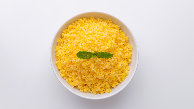 Bowl of couscous on a white background