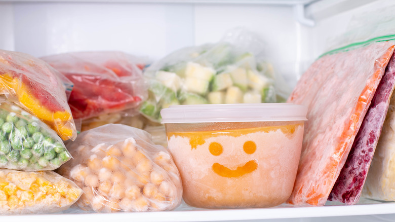 Frozen food containers in freezer