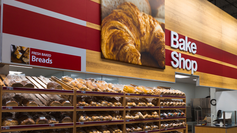 The freshly baked bread section of a Costco store has bread on shelves.