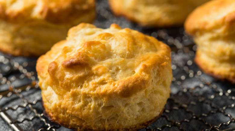 flakey buttermilk biscuits on a cooling rack