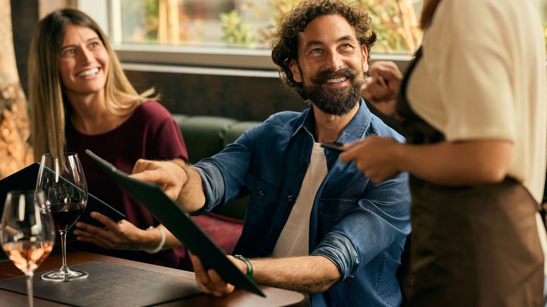 Diners asking their server a clarifying question